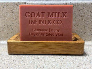 A beautiful, dusty-pink Rose Clay & Goat Milk soap bar by Infini & Co.