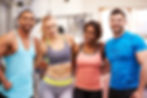 Happy group of gym buddies with arms around each other.jpg