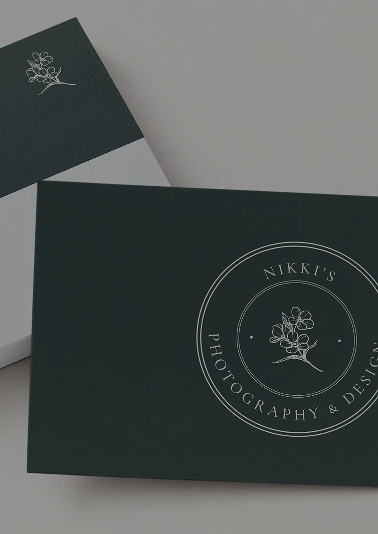 Up-close pictures of business cards against white background surface.