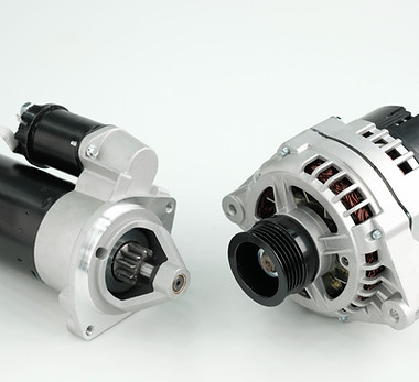 Spare parts for the car engineNew car generator and starter close-up on a white background