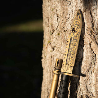 Bayonet with custom scrolls and gold cerakote