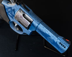 Blue titanium cerakote with laser etching, viking theme with valknut and fenrir, featuring runes and celtic style knots