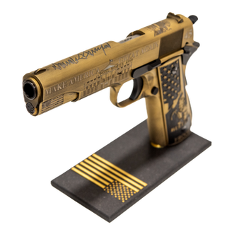 Trump themed engraved and cerakoted 1911 with Trump's signature, and custom American flag stand