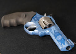 Blue titanium cerakote with laser etching, viking theme with valknut and fenrir, featuring runes and celtic style knots