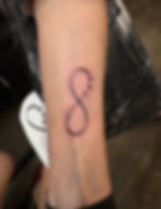Infinity tattoo with stars by Megan May