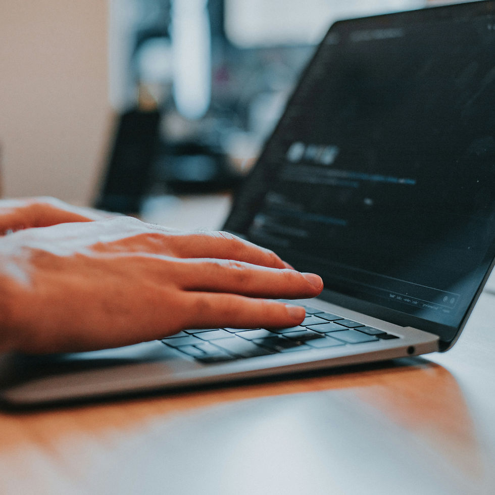 Man on Laptop Developing Application for Emergence Digital