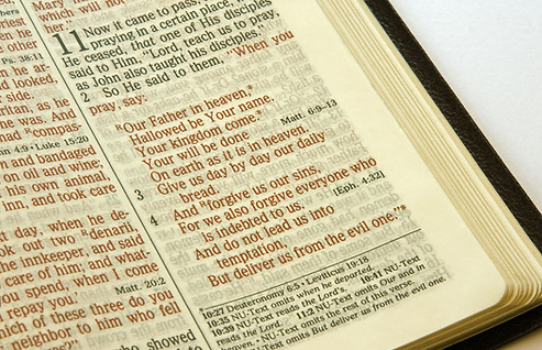 Bible opened up to The Lord's Prayer
