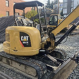 Construction equipment preparing an Eastlake lot for development
