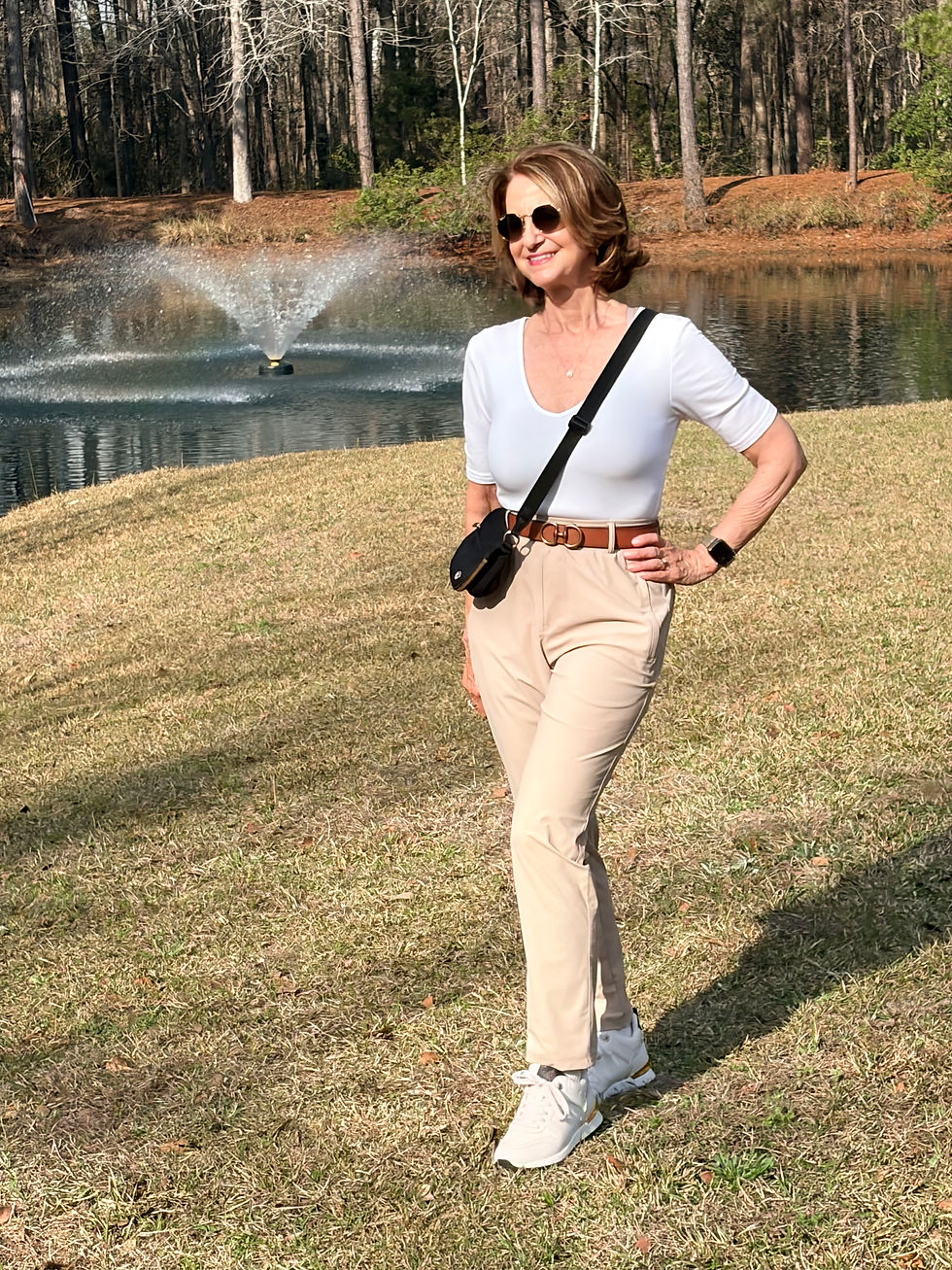 woman carrying  black lululemon crossbody bag