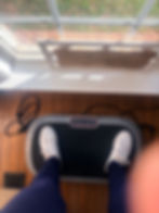 petite woman standing on vibrating plate