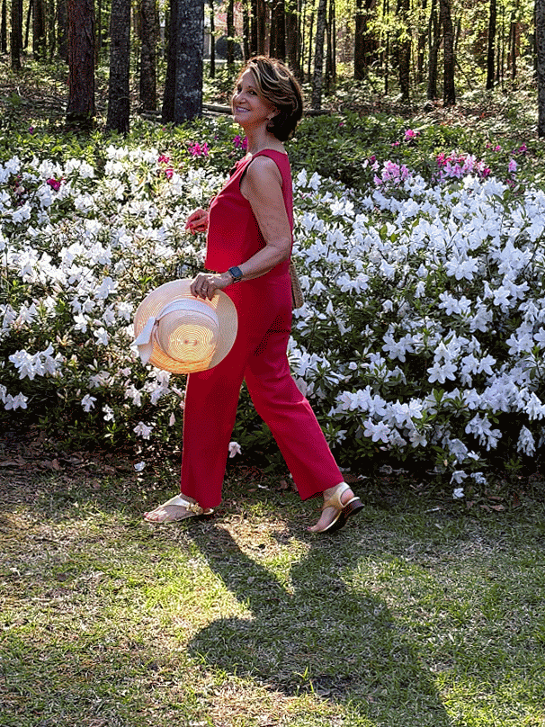 The crop linen set worn by a petite woman over 60 exposes the ankle further elongating her petite body.
