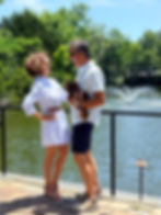 couple standing in front of fountain