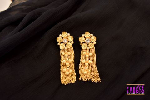 Golden Floral Charm with flowing Tassel