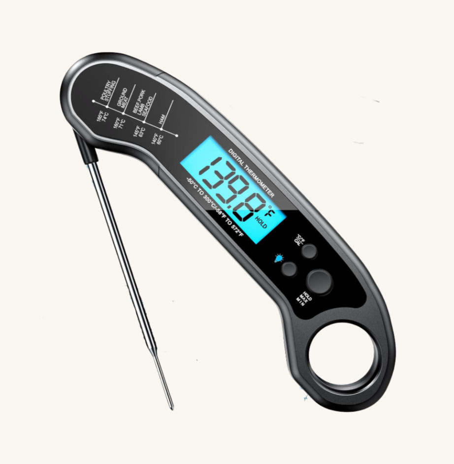Digital meat thermometer with a metal probe, showing 139.8°F on a blue display. Black casing, white text, set against a plain backdrop.