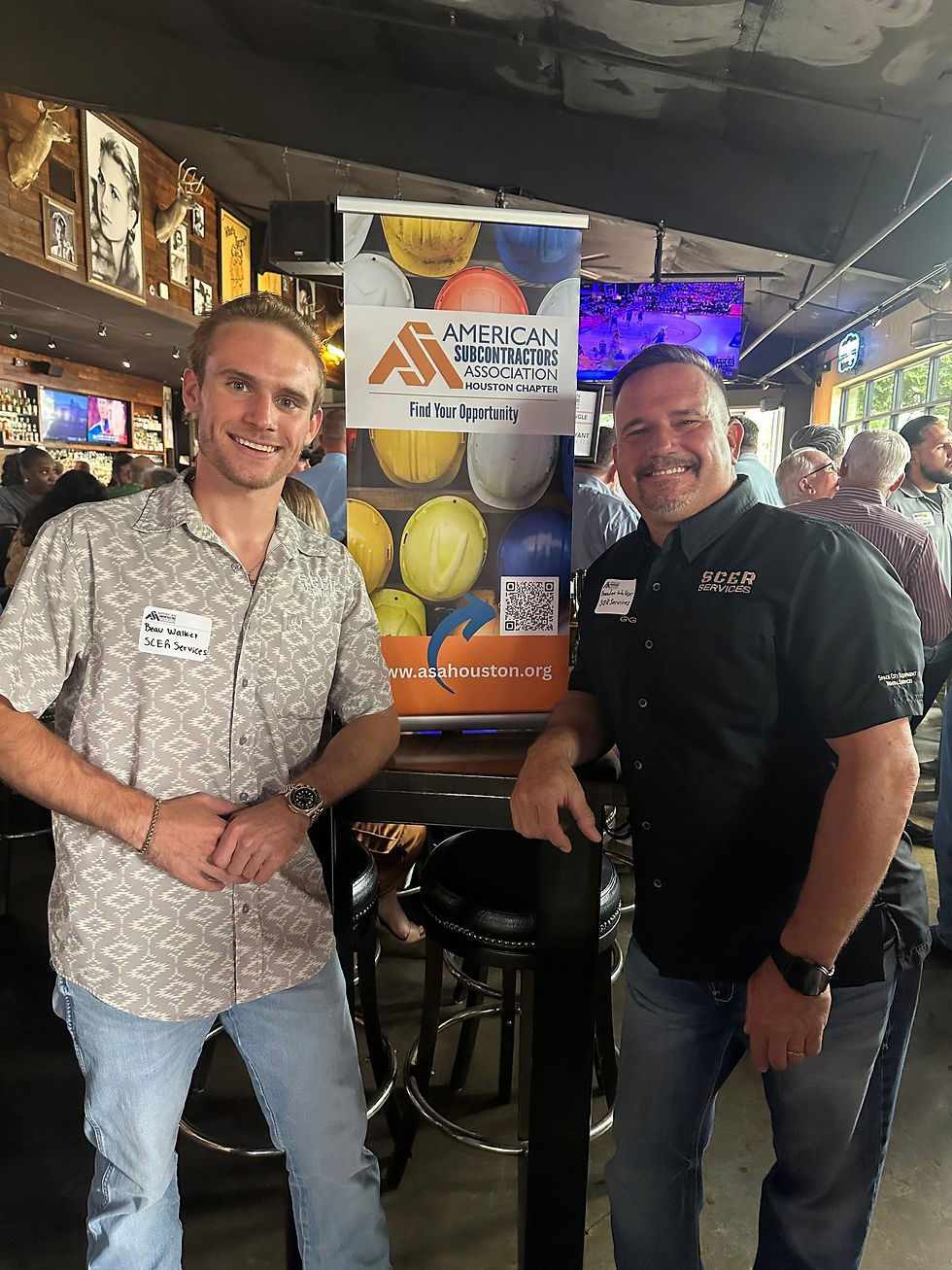 Owners of Space City Equipment Rental Services are at a Social Event for the American Subcontractors Association Houston Chapter