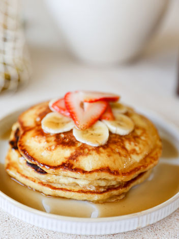 Fluffy homemade pancake with strawberry and banana