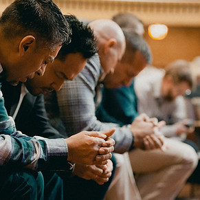 men praying