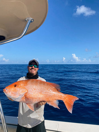 Red Snapper being held by a happy client 