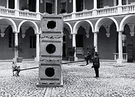 Children playing on "Wall /Event" swing
