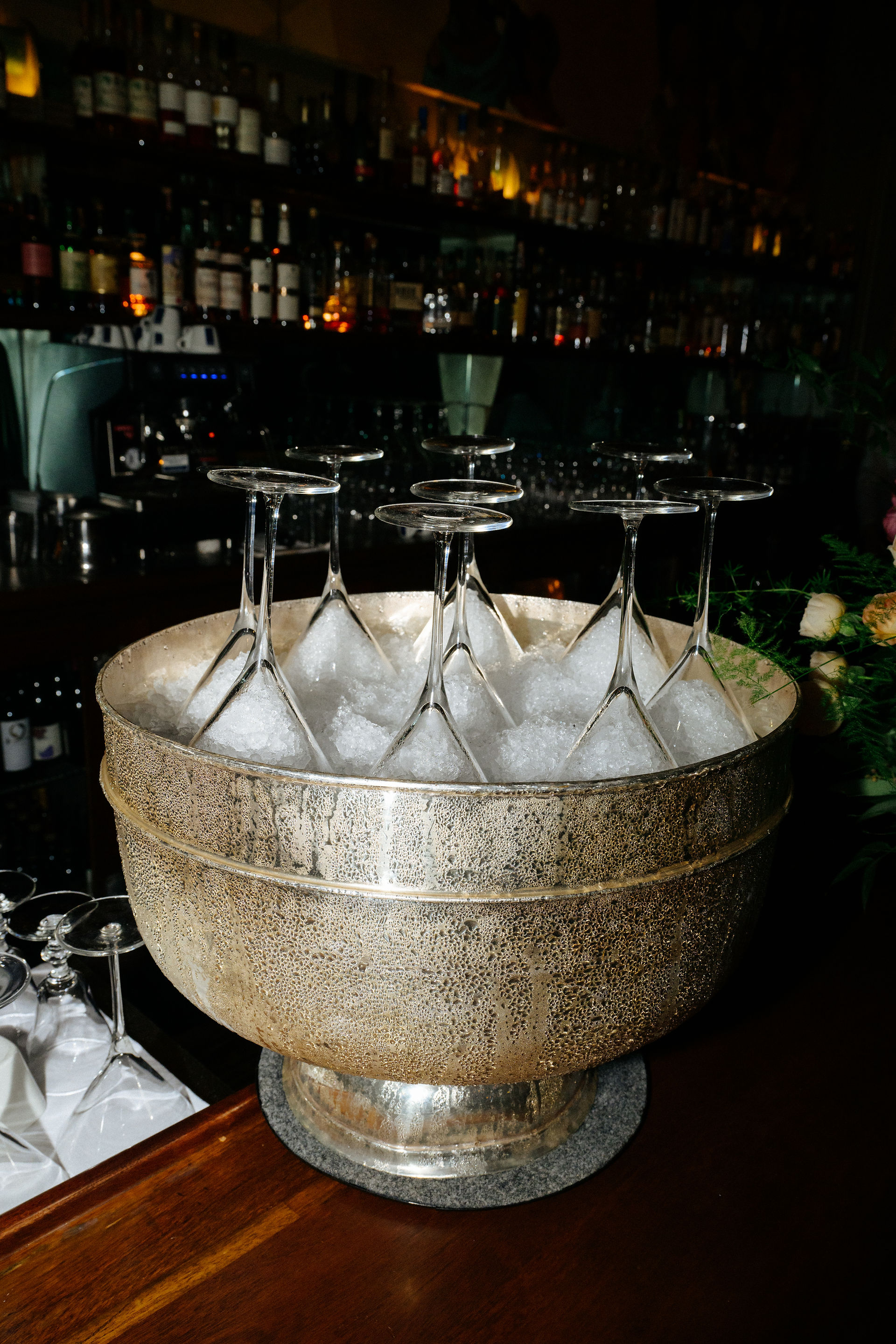 martini glasses chilling on ice at bar during san francisco restaurant wedding reception