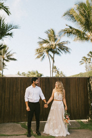 married couple with tropical background