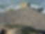 Stone labyrinth on a rocky cliff by the sea, waves crashing in the background. The intricate pattern creates a calm, meditative atmosphere suggesting the labyrinth changing spiritual direction work is encountering in our contemporary world.