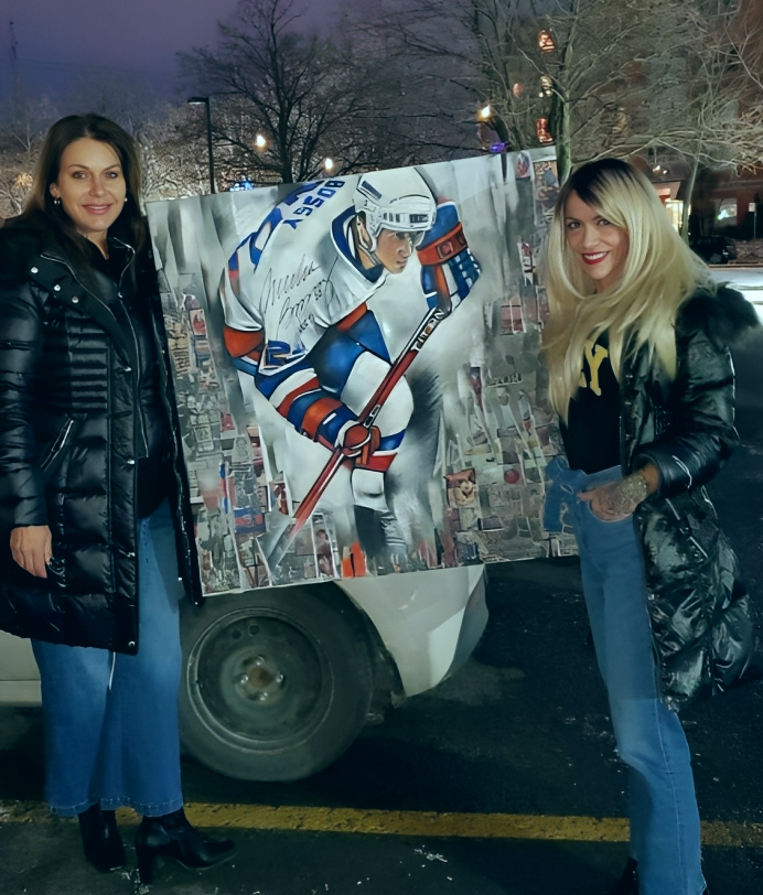 Josiane Bossy and Katrine holding a portrait of Mike Bossy "The Boss"
