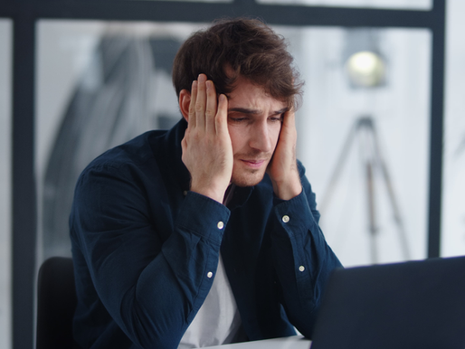 Man at computer feeling frustrated