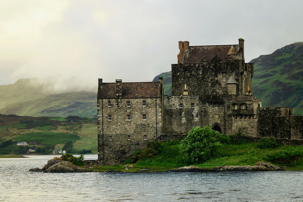 Scottish castle with a lake and hills George Hiles