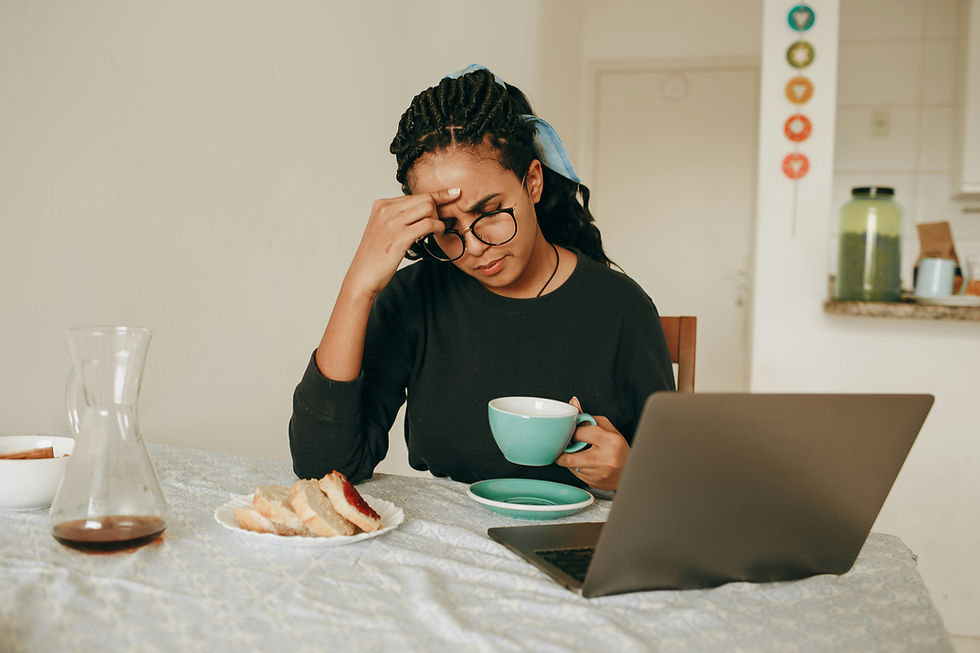 Why is writing so difficult? Isn’t there an easier way to get writing done? Photo credit Helena Lopes. Woman at desk with open computer struggling to put thoughts into words