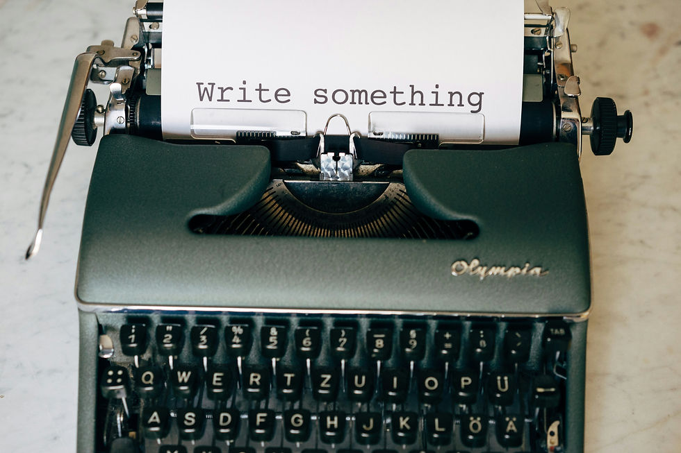 Four ways to move your book project forward. Photo credit: Markus Winkler. A vintage typewriter made by Olympia with a sheet that reads: "write something"
