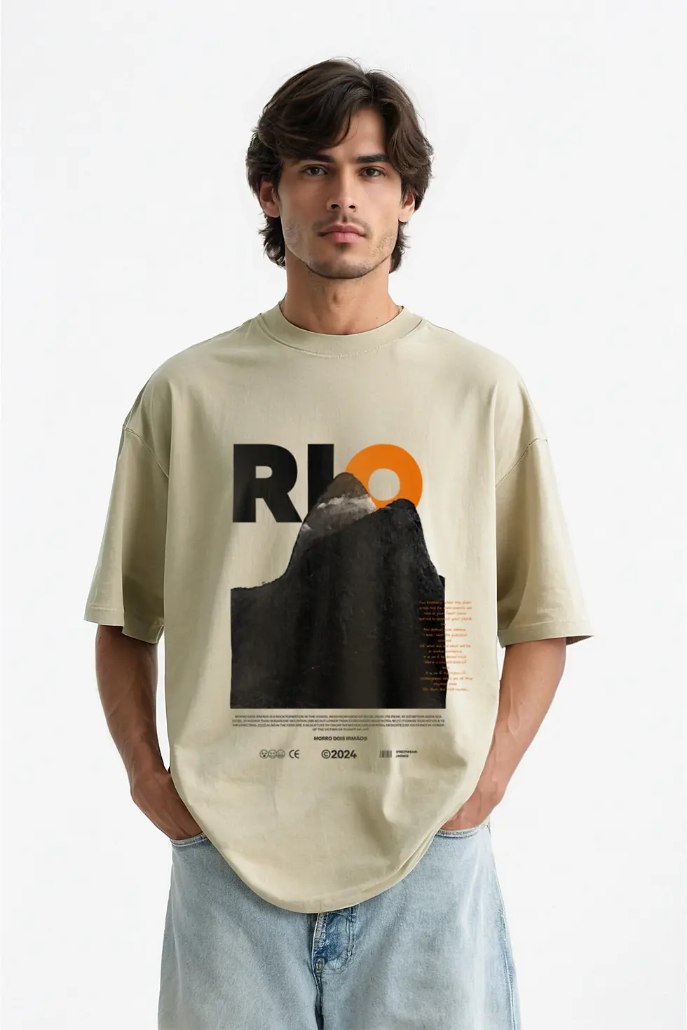 Model wearing KENDZ men’s oversized beige washed t-shirt with Rio front print - streetwear style