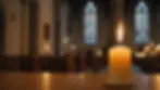 Close-up view of a candle lit in a church