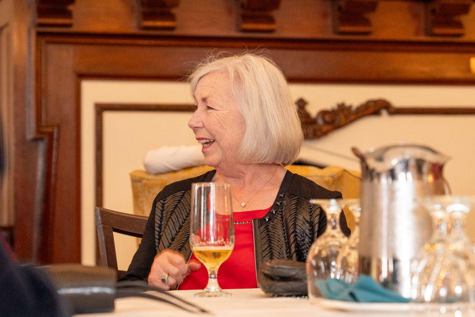 Guest smiling during a milestone birthday slideshow at Scarboro Golf & Country Club in Toronto.