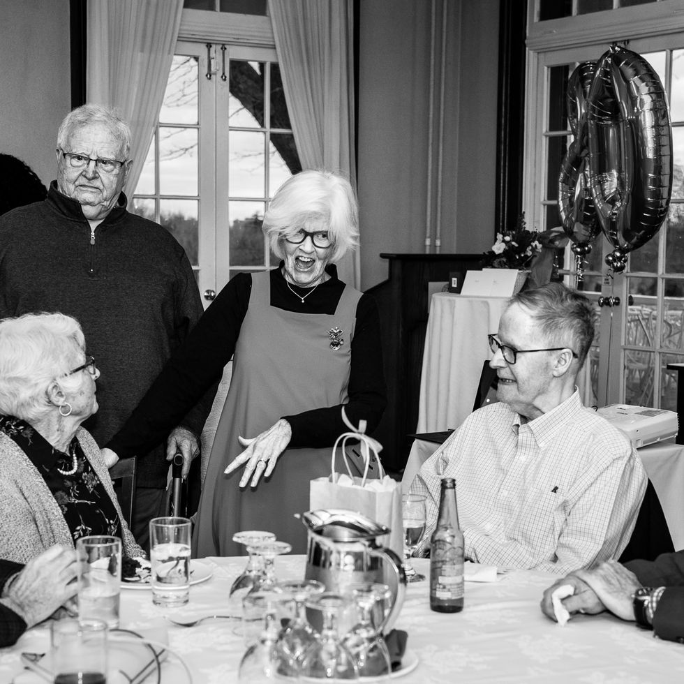 Guests enjoying a milestone event in Toronto with warm evening light