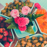 pink flowers on white plastic container_