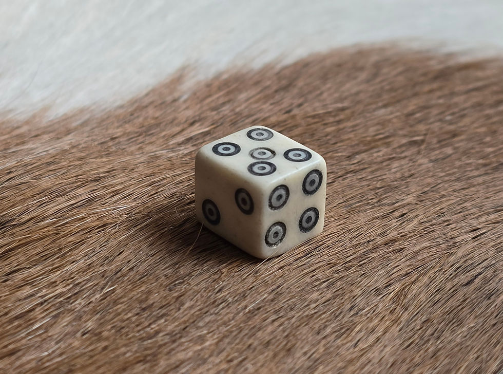 Thumbnail: One hand made real animal bone die with dot and circle markings.