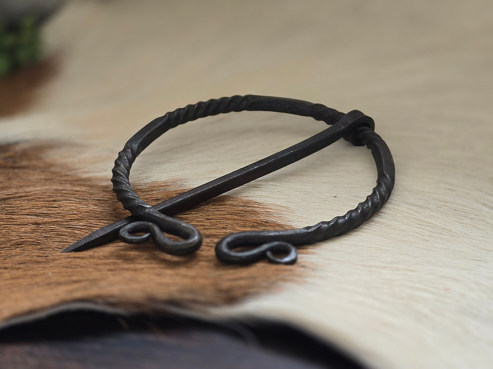 Thumbnail: Twisted ring brooch, double coil design, hand-forged.