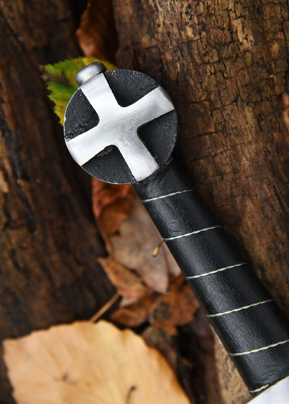 Thumbnail: The blade of our replica is forged from spring steel and goes through to the round cast iron pommel, where it is screwed invi