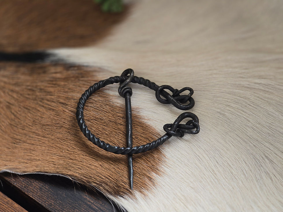 Thumbnail: Twisted ring fibula with snake tail, handforged