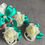 Thumbnail: Ivory Rose with Teal Ribbon Corsage