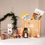 Thumbnail: Eco-friendly Christmas gift hamper with wine, sweet treats, and crackers