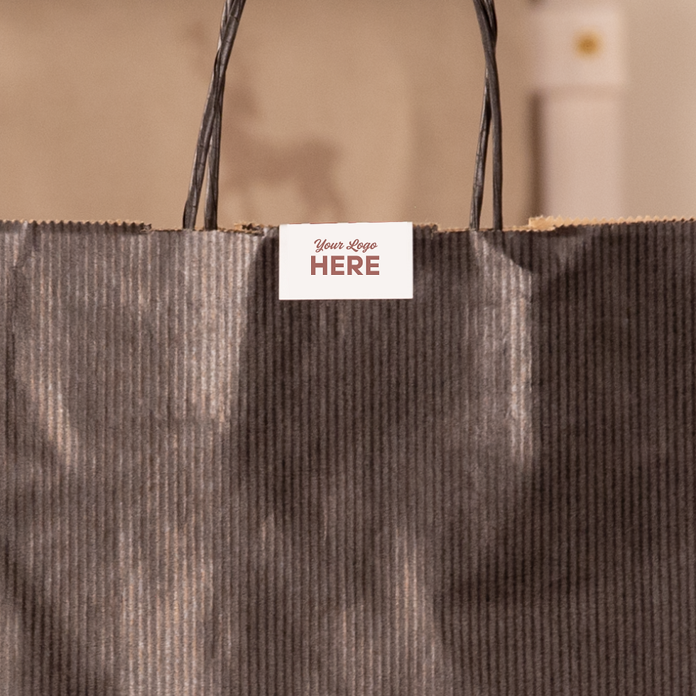 Black reusable jute gift bag with branded tag on a neutral background