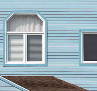 115406128-detail-of-the-facade-of-the-typical-blue-wooden-houses-of-iles-de-la-madeleine-o