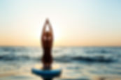 silhouette-beautiful-woman-practicing-yoga-surfboard-sunrise.jpg