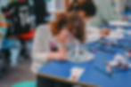 A girl doing arts and crafts at our HAF programme