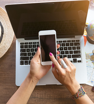   Hipster young woman  planning of her vacation  trip and searching information or booking