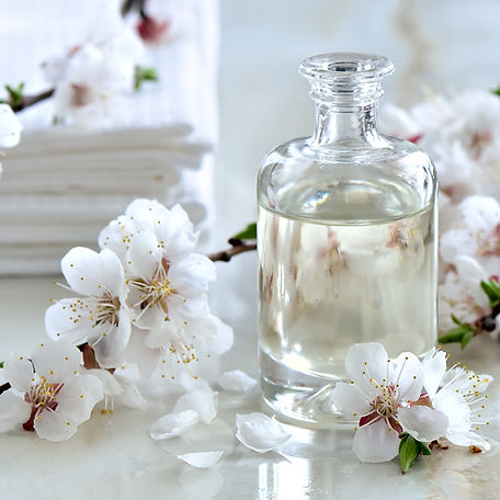 Spa massage oil decorated with spring blooming branches, special formula of essential oils