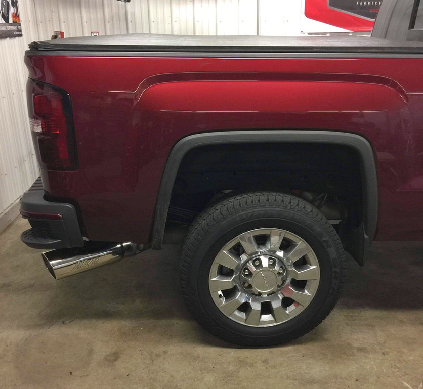 Maroon pickup truck rear, chrome wheel and exhaust