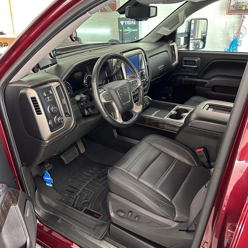 Red Duramax truck interior, driver's view